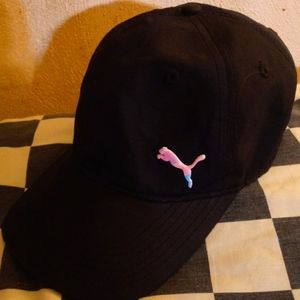 Puma black baseball hat with pink and blue logo. Adjustable so one size fits all